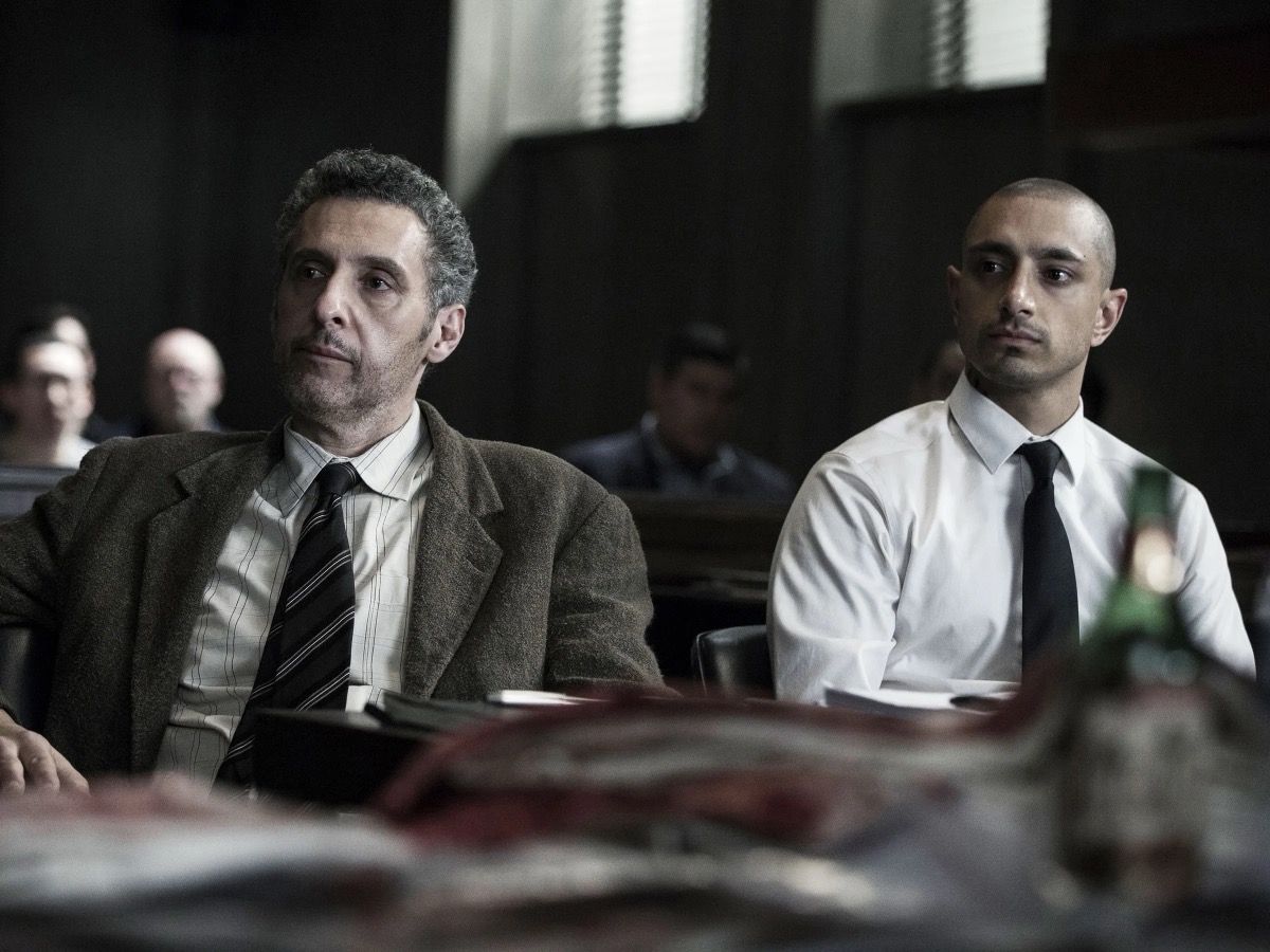 A defendant and his lawyer sit in a courtroom in "The Night Of" 