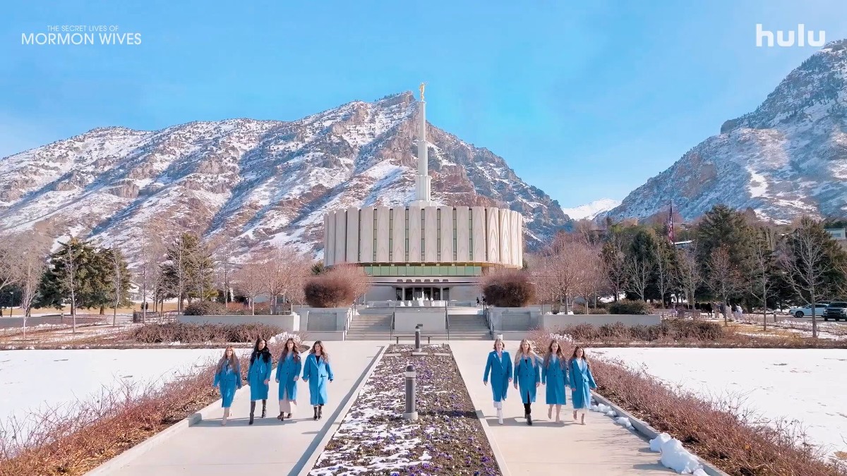 The Secret Lives of Mormon Wives cast in front of a church