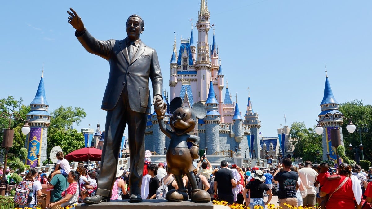 The Walt Disney and Mickey Mouse statue at Disney World