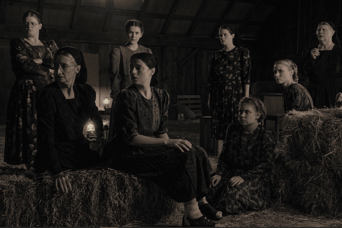 A group of Mennonite woman discuss in a barn in "Women Talking"