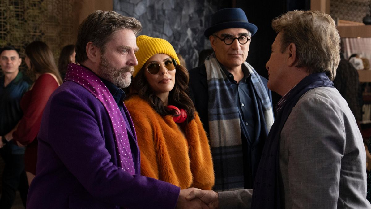 Zach Galifianakis shakes hands with Martin Short as Eva Longoria and Eugene Levy watch on in Only Murders in the Building