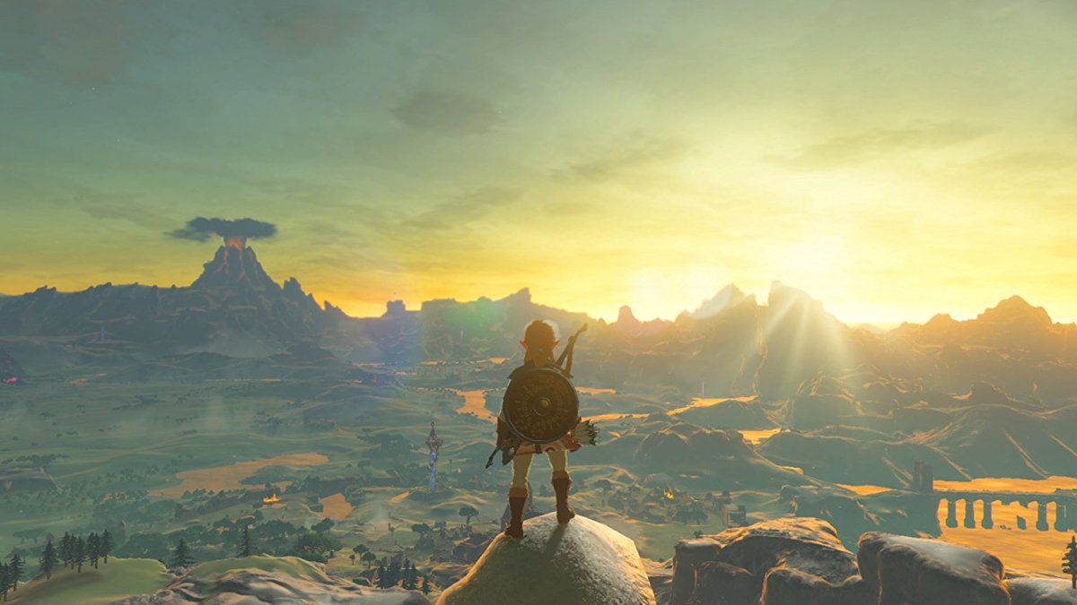 Link looks over Hyrule from a high perch in The Legend of Zelda: Breath of the Wild