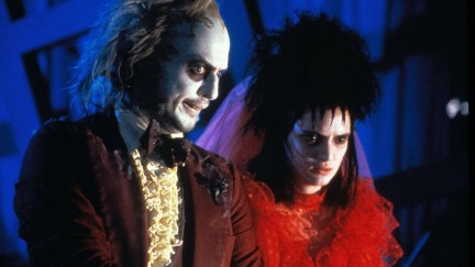 beetlejuice and lydia standing next to each other