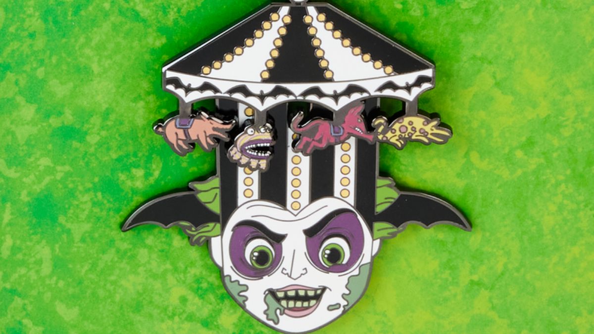 An enamel pin of Beetlejuice in his carousel hat.