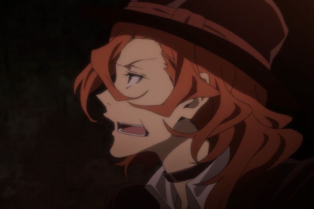 Chuuya Nakahara, a red haired man in a brown hat, making a face.