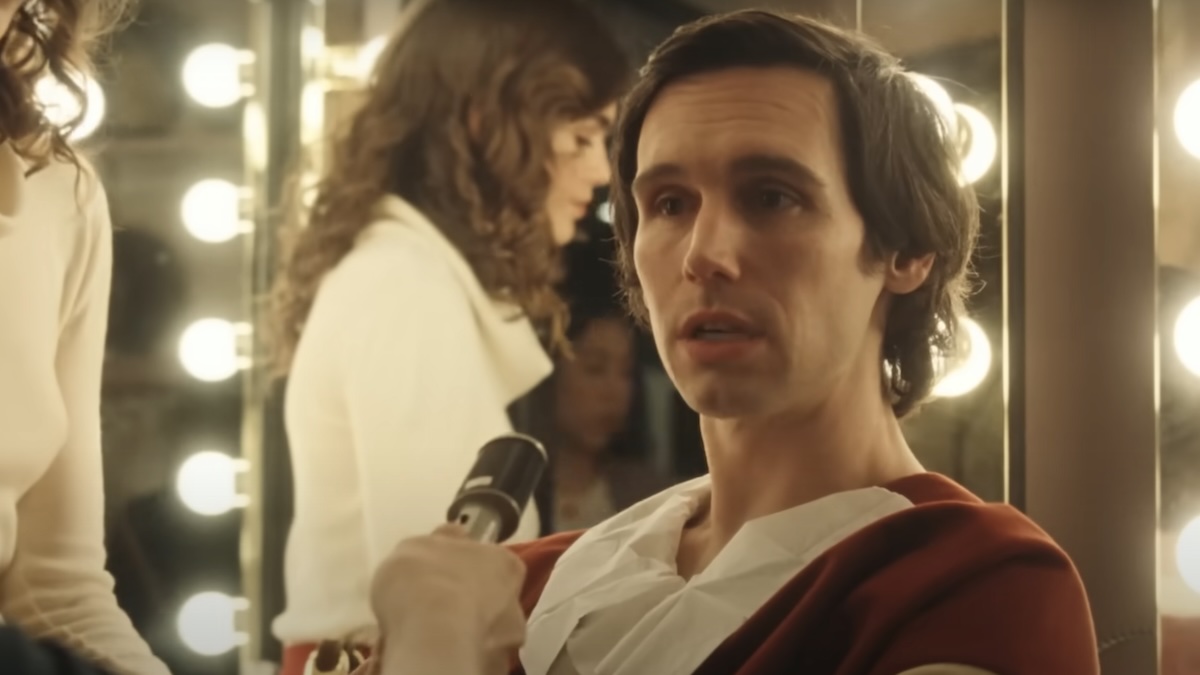 cory michael smith sitting in front of a mirror