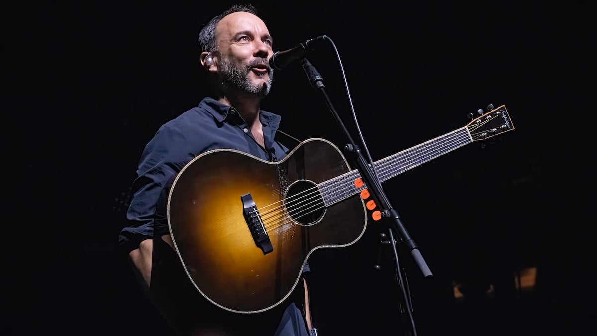 dave matthews on stage with a guitar