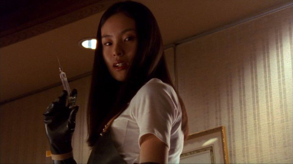 Eihi Shiina as Asami holding a syringe in Audition.