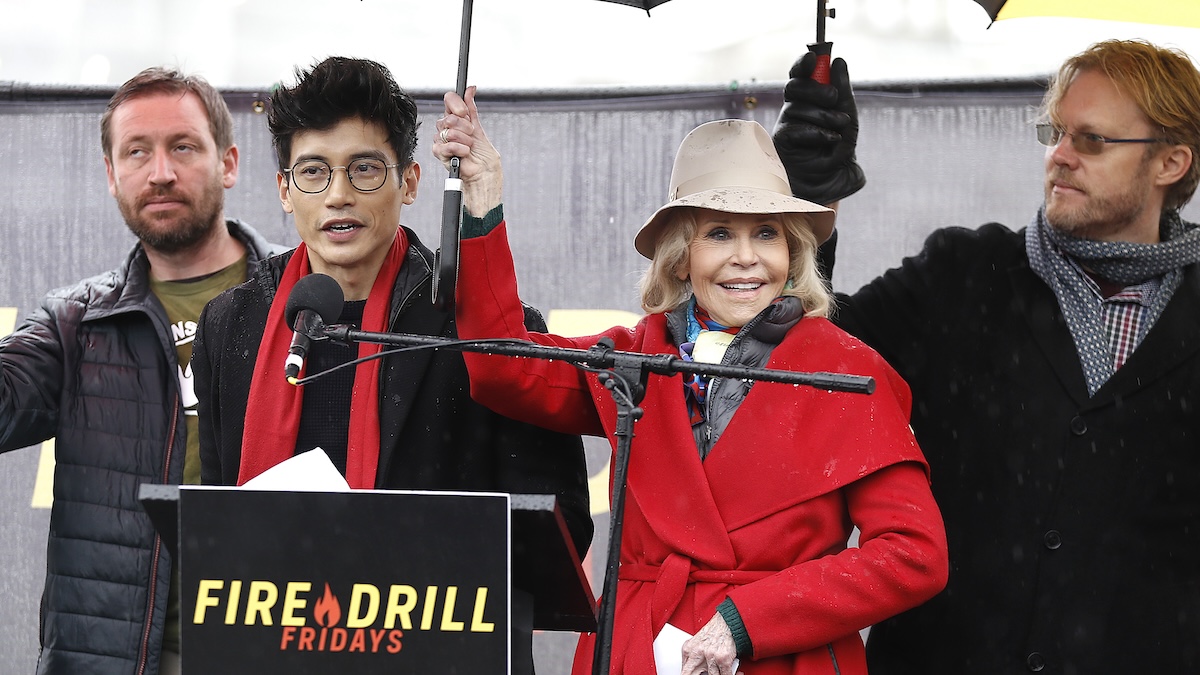 Manny Jacinto and Jane Fonda standing on a stage together