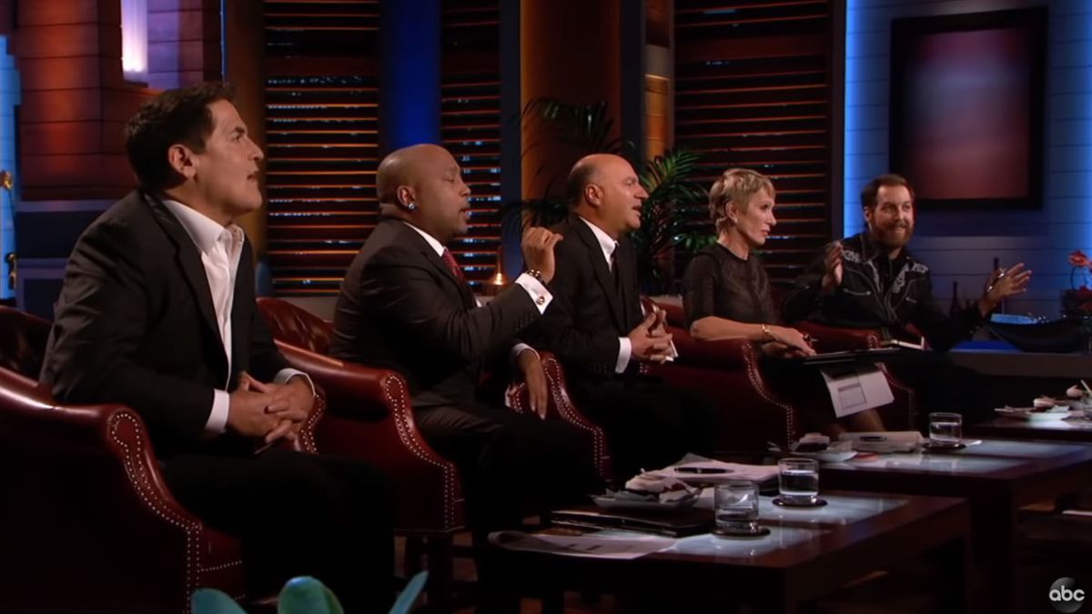 Marc Cuban, Daymond John, Kevin O'Leary, Barbara Corcoran, and Chris Sacca listen to a pitch on Shark Tank.