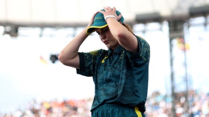 B-Girl Raygun of Team Australia reacts during the B-Girls Round Robin - Group B on day fourteen of the Olympic Games Paris 2024. She looks frustrated, grabbing her head with both hands.