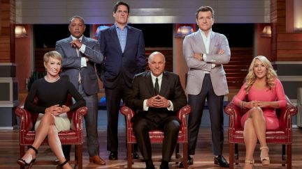 Barbara Corcoran, Daymond John, Mark Cuban, Kevin O’Leary, Robert Herjavec, and Lori Greiner posing for Shark Tank promo.