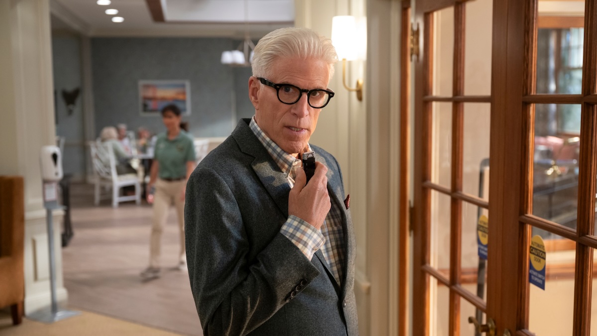 ted danson standing in a hallway