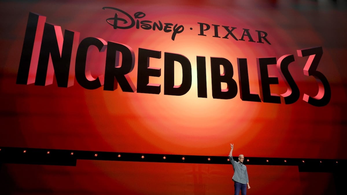 the incredibles 3 logo on stage with pete docter