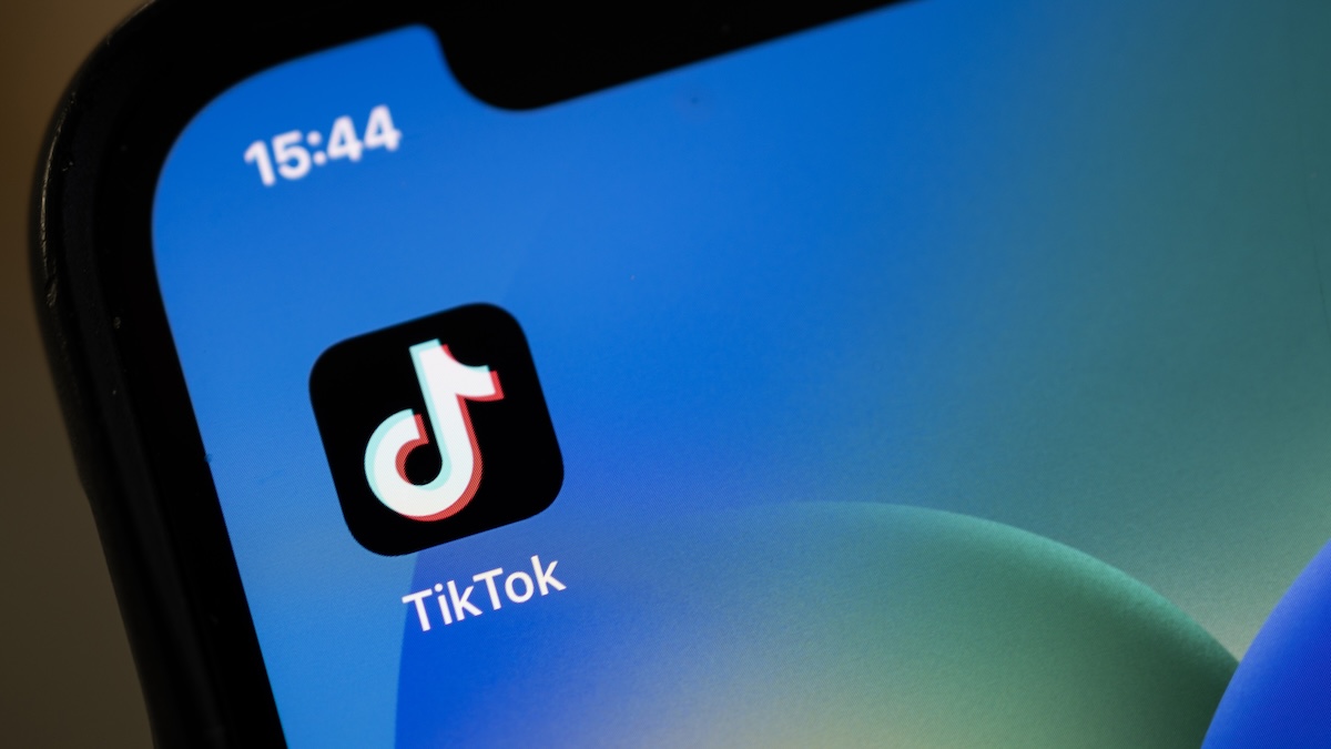 a phone with the tiktok logo on it