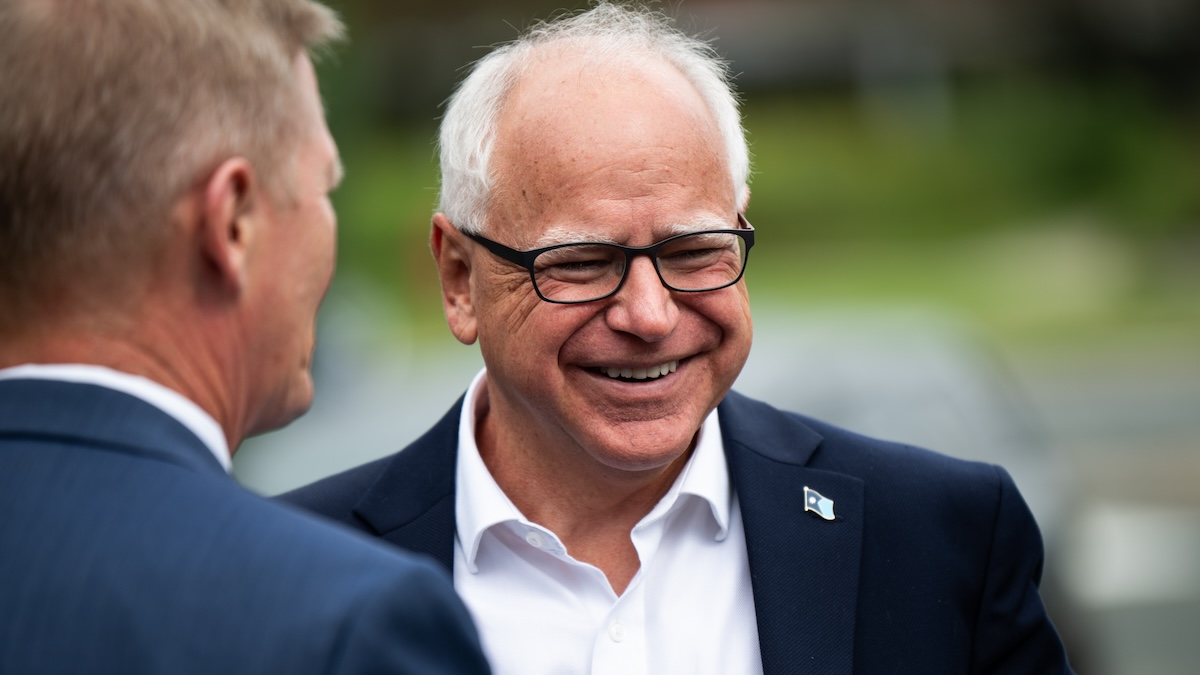 Tim Walz with a smile on his face