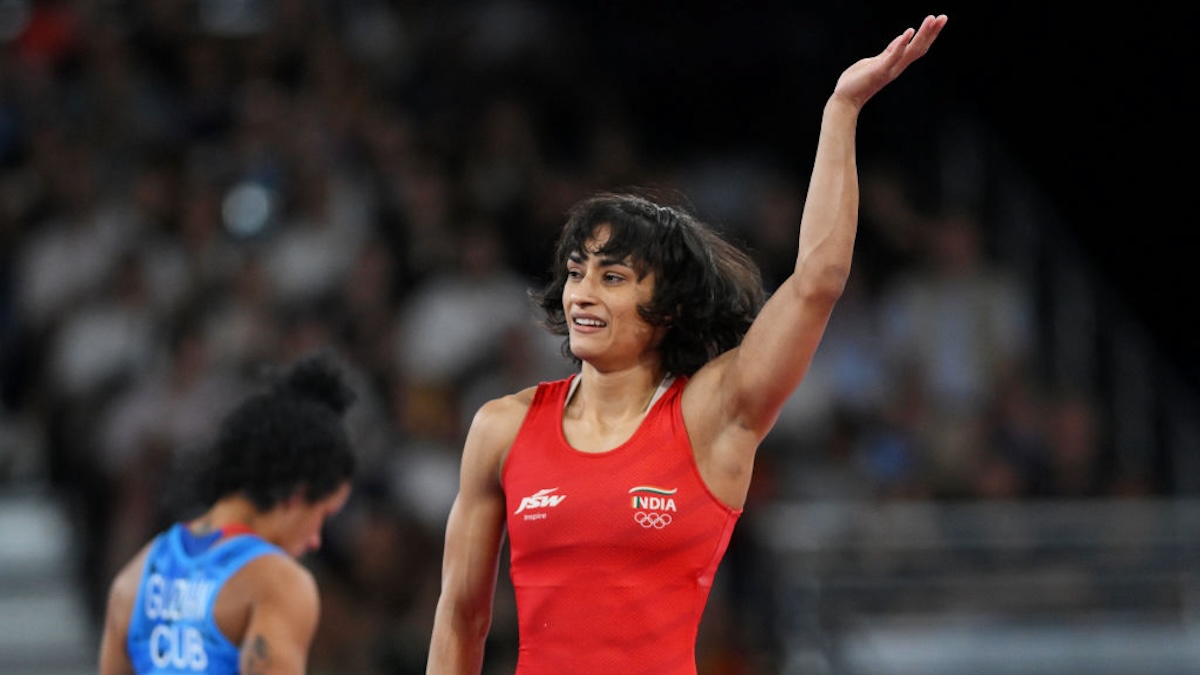 Vinesh Vinesh of Team India (red) celebrates victory against Yusneylis Guzman Lopez of Team Cuba during the Wrestling Women's Freestyle 50kg Semifinal on day eleven of the Olympic Games Paris 2024.