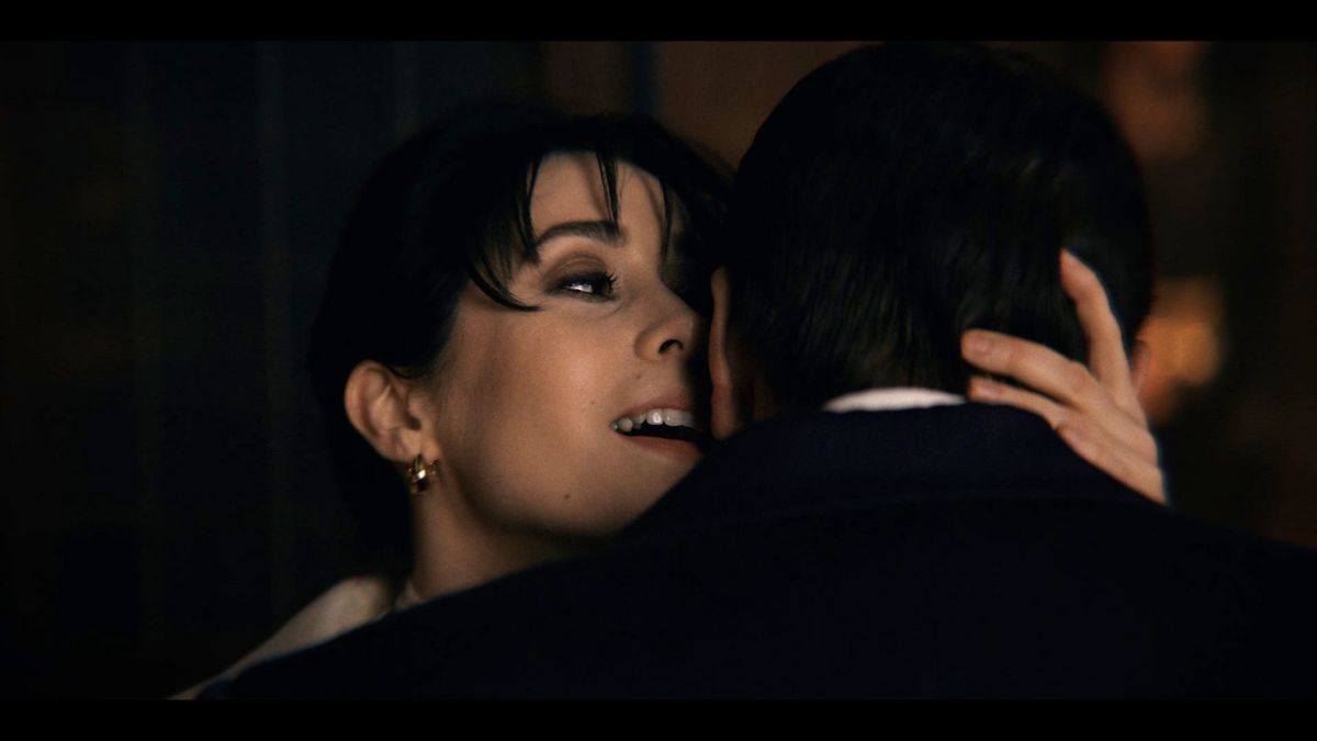 Cristin Milioti as Sofia Falcone whispers something in Colin Farrell as Oz Cobb's ear in The Penguin