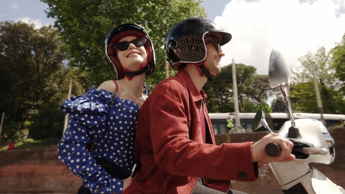 Emily and Marcello ride on a Vespa in Rome, Emily in Paris S4