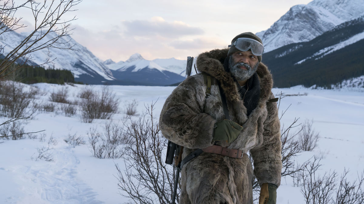 A grizzled hunter wanders a snowfield in "Hold the Dark" 