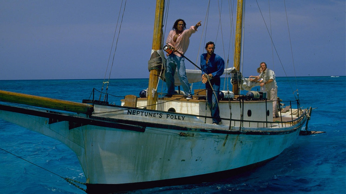 A group of people sail on a small ship in "Jaws The Revenge"