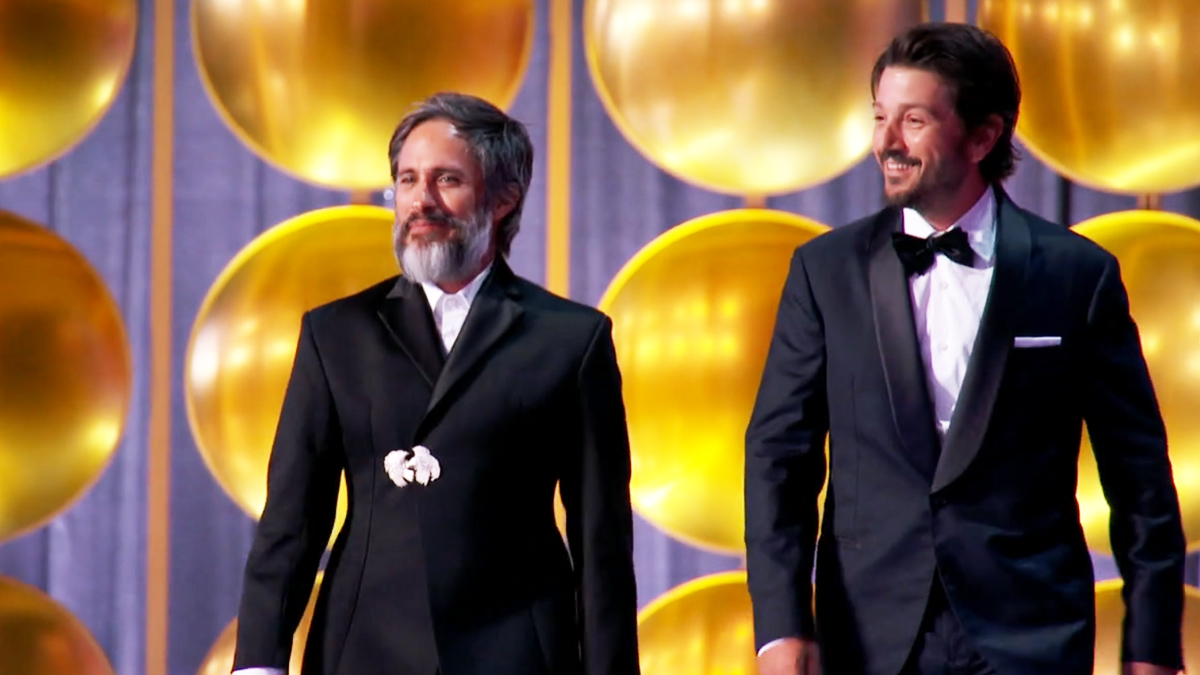 From left to right, Gael Garcia Bernal and Diego Luna walking on stage at the Emmy Awards.