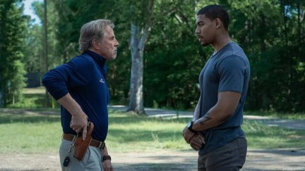 A former marine calmly confronts a cop with a hand on his gun in 