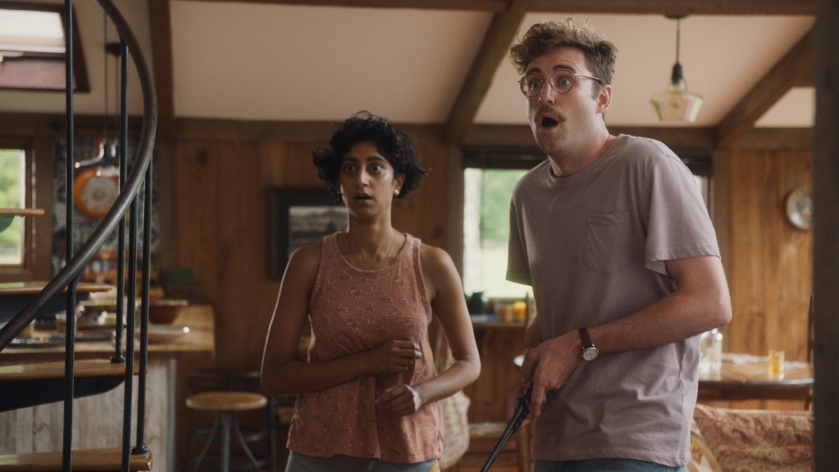 A hipster couple look flabbergasted in a cabin in "Save Yourselves"