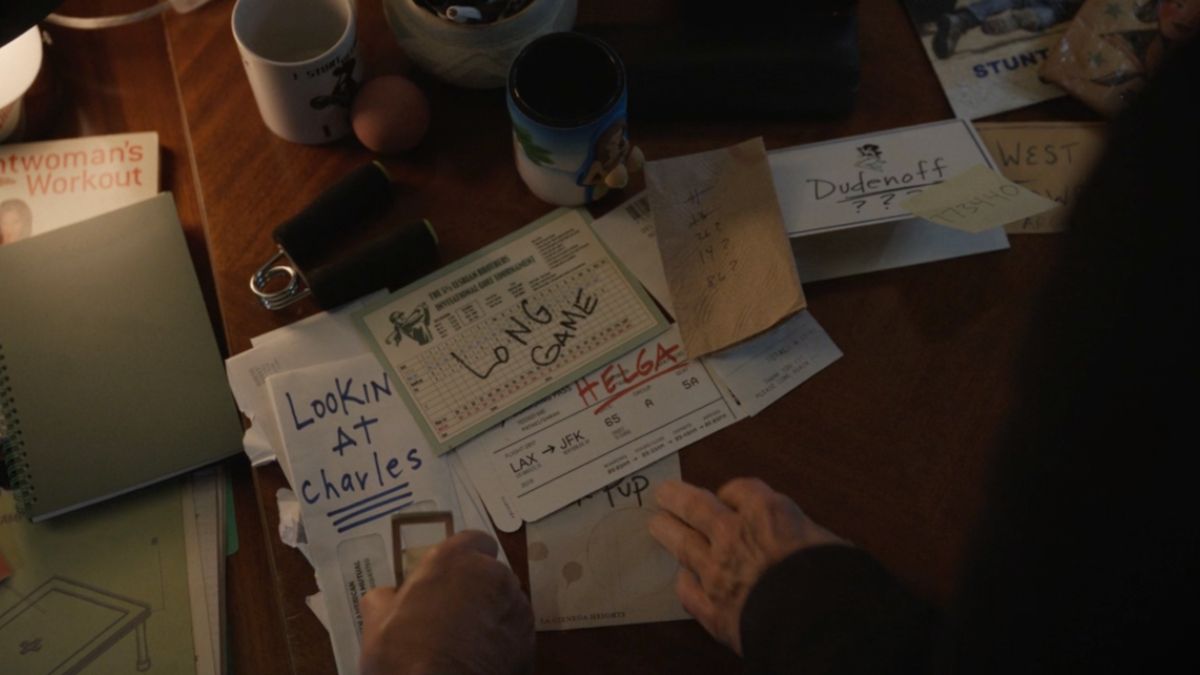 Papers and notes on Sazz Pataki's desk in Only Murders in The Building season 4