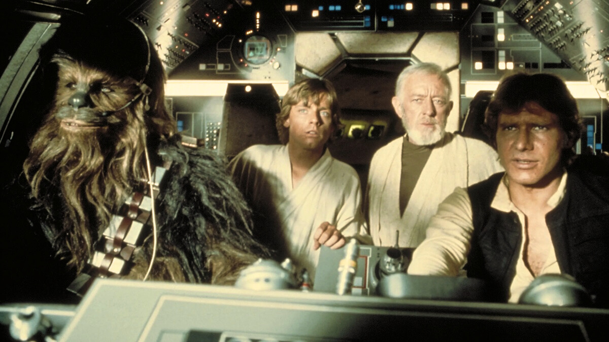 Chewbacca, Luke, Obi Wan, and Han Solo inside the Millennium Falcon in Star Wars