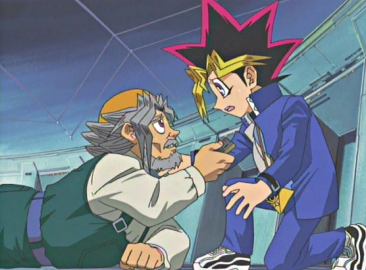 An old man falls at his grandson's feet in "Yu Gi Oh"