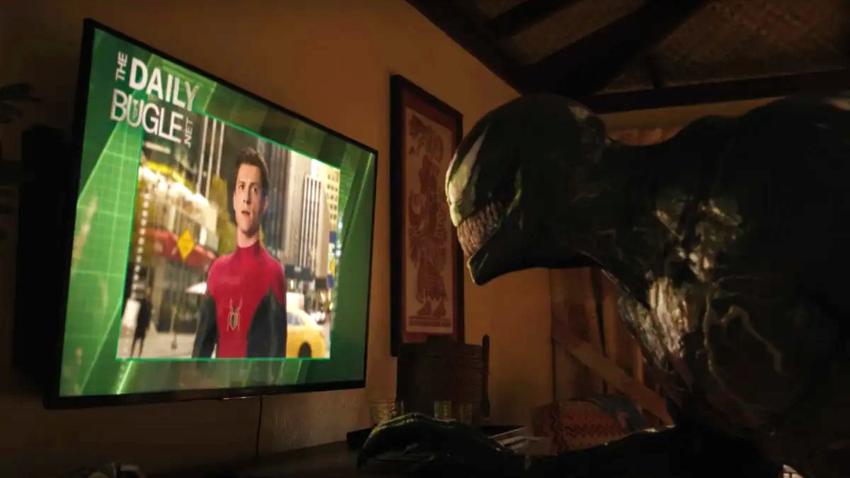 Venom looking at Tom Holland's Spider-Man on TV in Venom: Let There Be Carnage