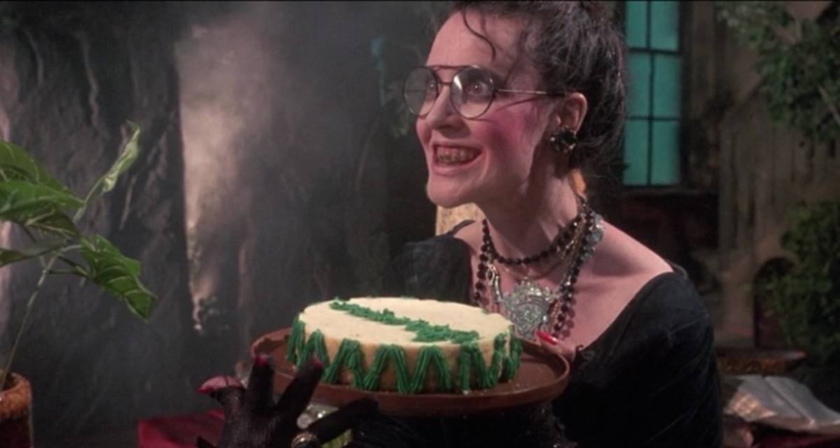 A creepy witch woman smiles in "Troll 2" 