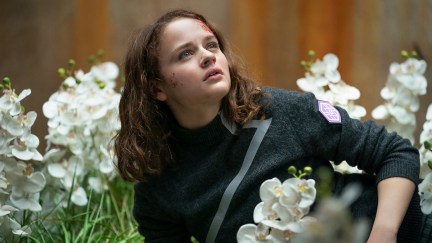 Joey King as Tally surrounded by flowers in 'Uglies'