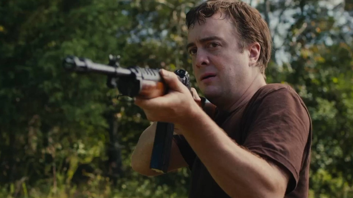 A nervous looking man levels a rifle in "Blue Ruin" 