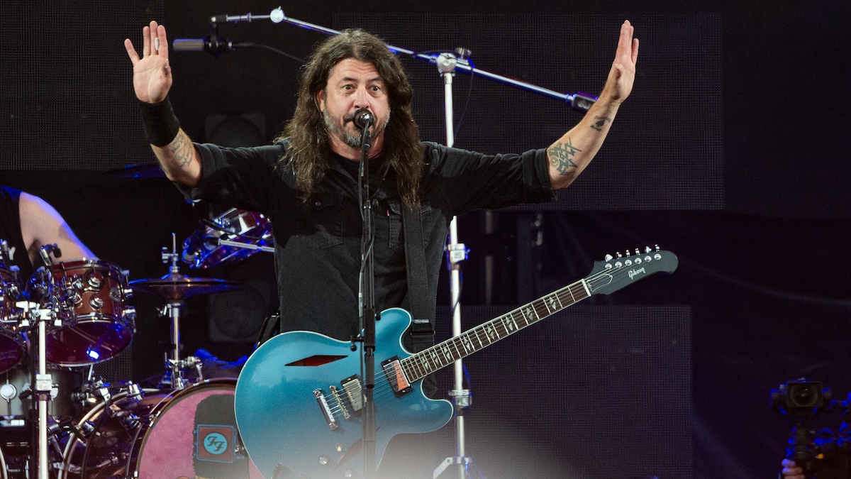 Dave Grohl with his hands in the air