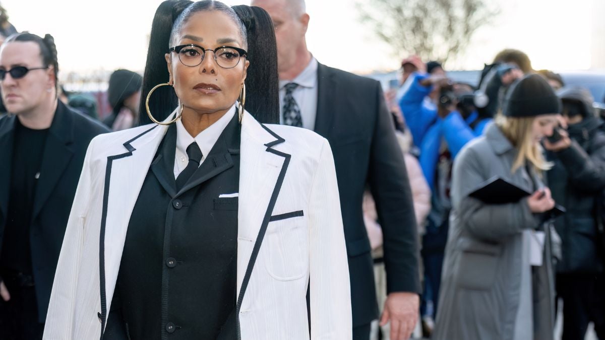 Janet Jackson pictured in a white and black suit at the Thom Browne fashion show during New York Fashion Week