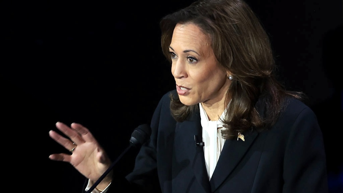 Kamala Harris debating Donald Trump, looking confident.