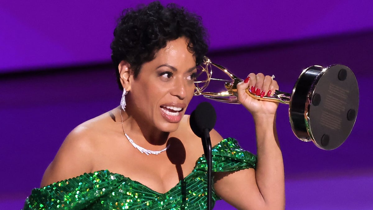 Liza Colón-Zayas holds up her Emmy while giving her award acceptance speech.