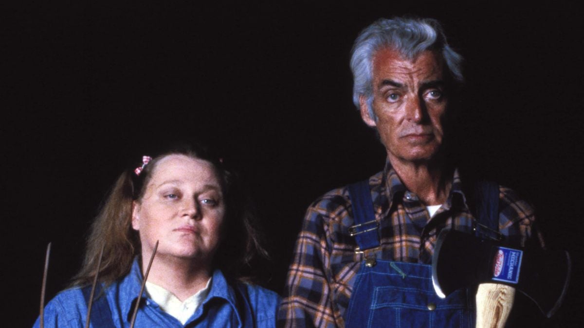 Ida and Vincent Smith standing side by side in Motel Hell. 