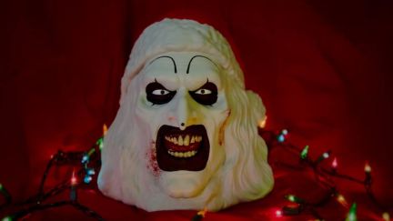 Terrifier 3 popcorn bucket featuring Art the Clown dressed as Santa.