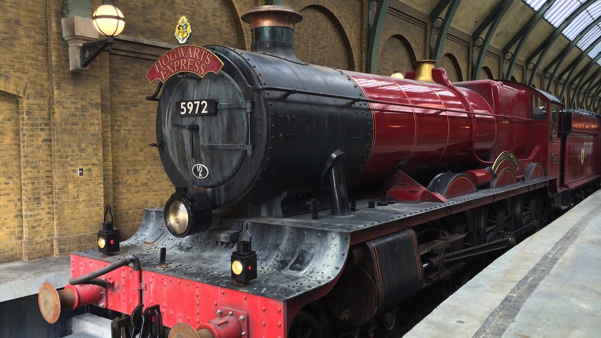 the hogwarts express sitting in a train station