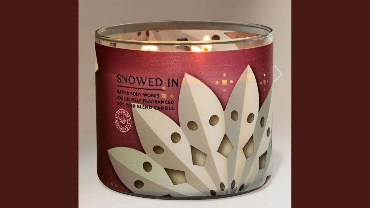 Bath & Body Works "Snowed In" candle with label that resembles KKK hoods