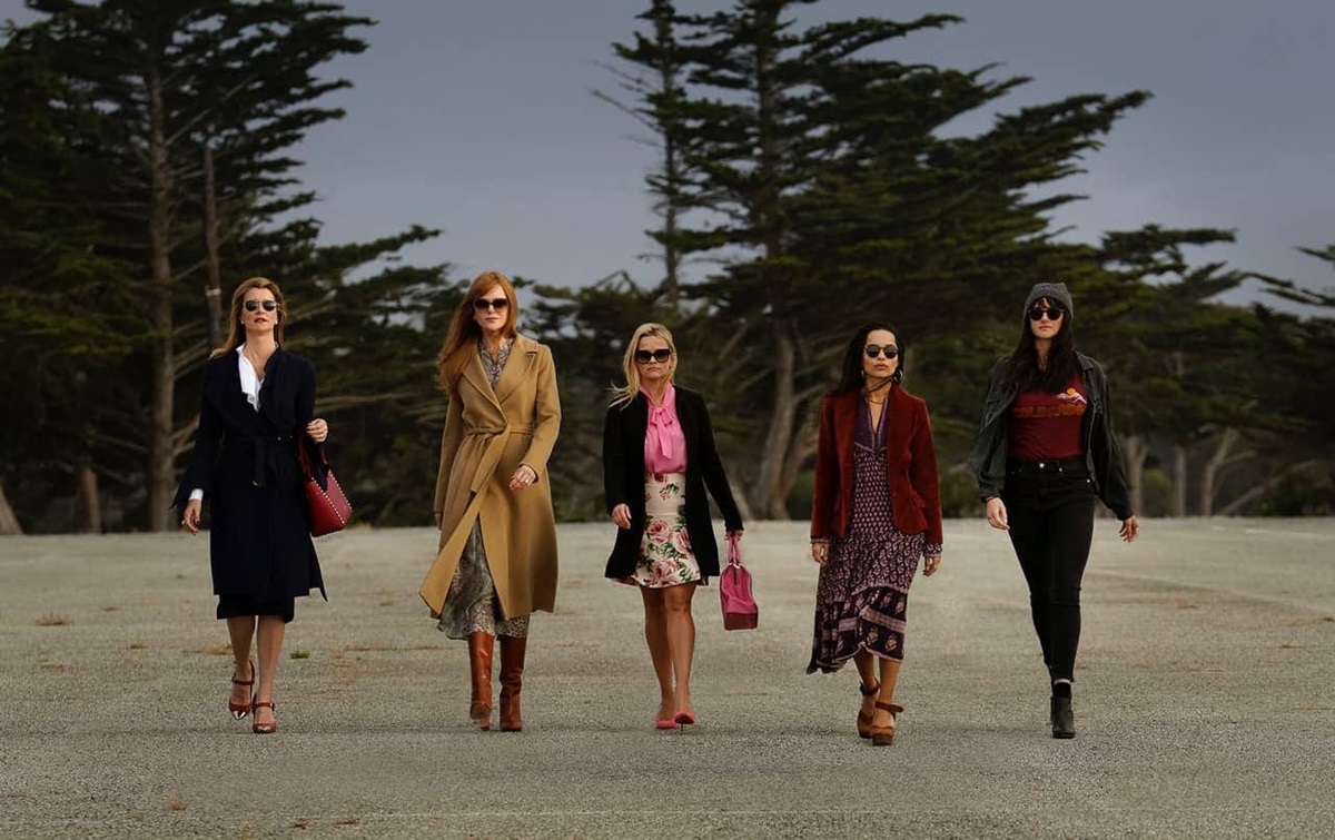 Five women walk on the beach with purpose