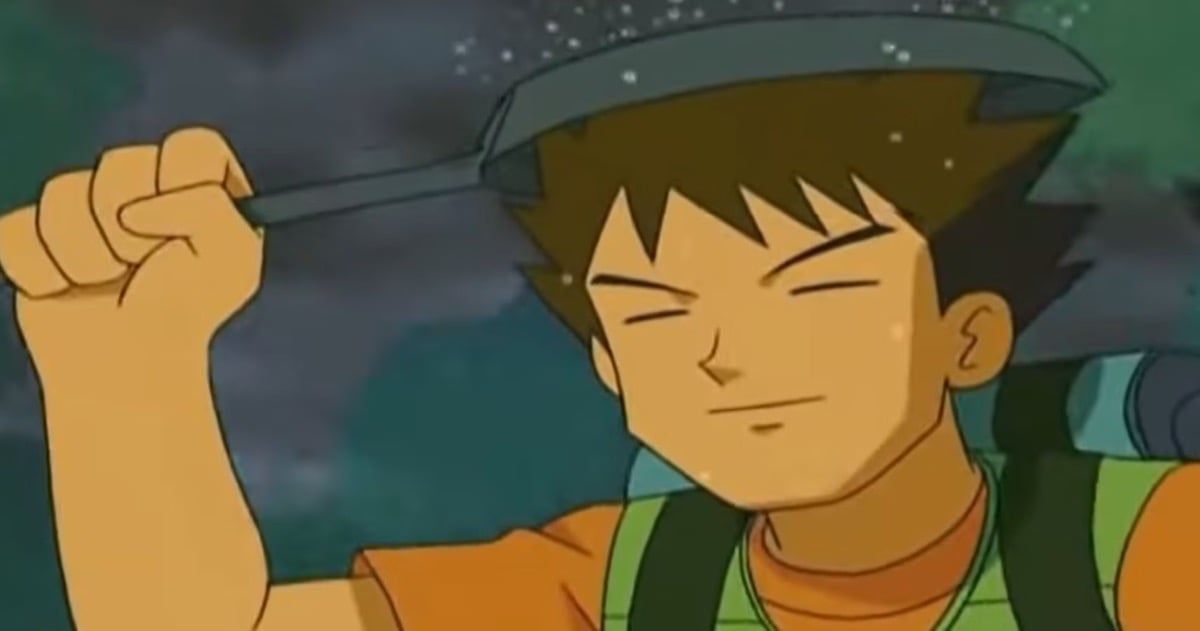 Brock stands in the rain with a frying pan over his head in "Pokemon"