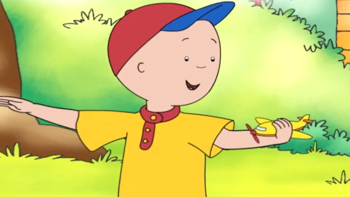 Four year old Caillou smiles and gestures in the woods in "Caillou"