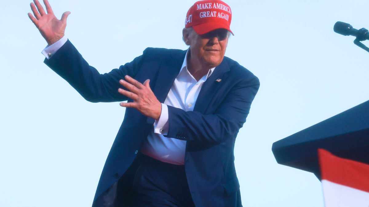 DORAL, FLORIDA - JULY 09: Former U.S. President Donald Trump pretends to swing a golf club as he speaks about U.S. President Joe Biden at a campaign rally at the Trump National Doral Golf Club on July 09, 2024 in Doral, Florida. Trump continues to campaign across the country. (Photo by Joe Raedle/Getty Images)