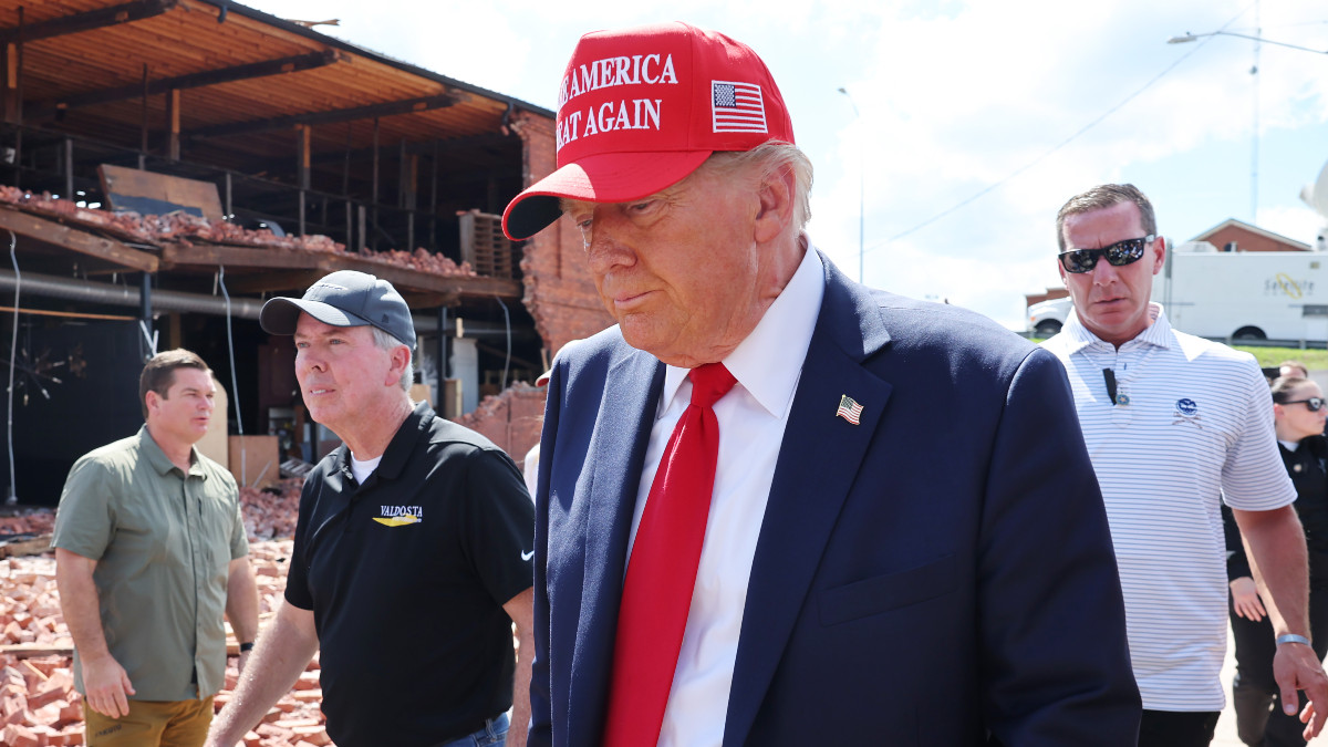 ATLANTA, GEORGIA - SEPTEMBER 30: Republican presidential nominee, former U.S. President Donald Trump prepares to leave after visiting Chez What Furniture store that was damaged during Hurricane Helene on September 30, 2024 in Valdosta, Georgia. Trump met with local officials, first responders, and residents who have been impacted by last week's hurricane which has left at least 90 people dead across Florida, Georgia, North Carolina, South Carolina, and Virginia. Millions are still without power, water, or reliable communications. U.S. President Joe Biden and Democratic presidential nominee, U.S. Vice President Kamala Harris have spoken with local leaders and stated that they plan to visit affected areas when the time is right. (Photo by Michael M. Santiago/Getty Images)