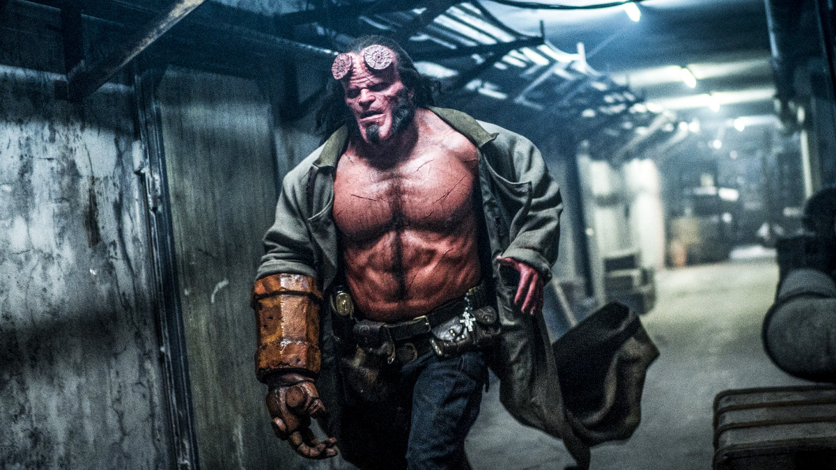 Hellboy running down a dark corridor in 'Hellboy 2019'