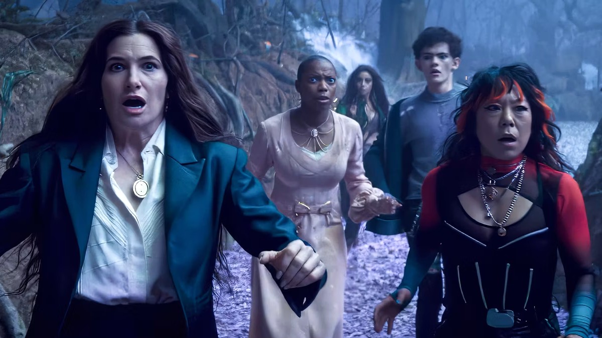 Kathryn Hahn as Agatha Harkness and her coven looking shocked in Agatha All Along